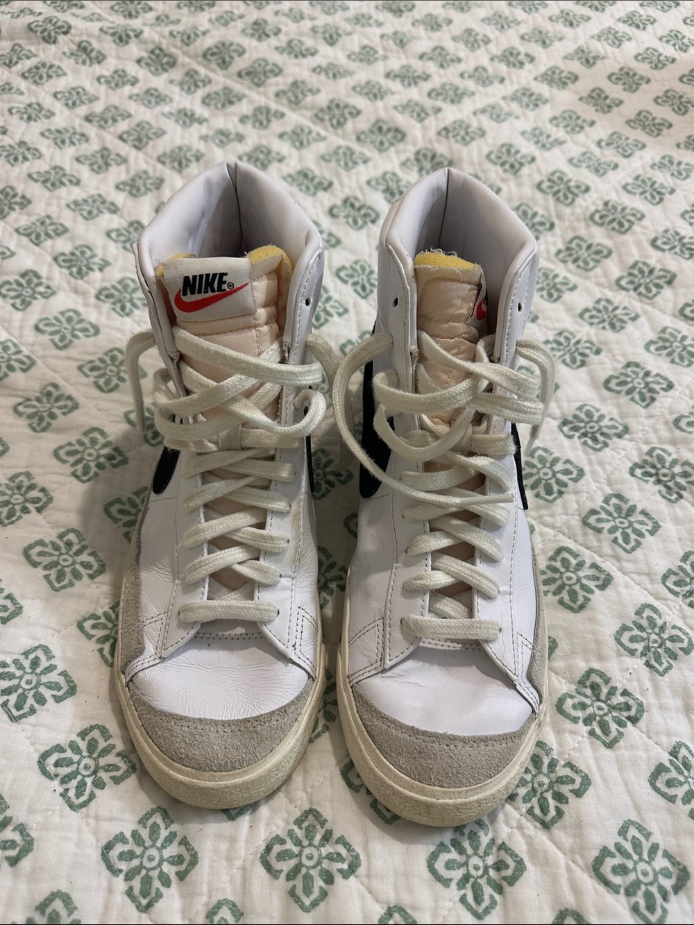 Nike White High-Top Sneakers with Black Swoosh and Red Logo